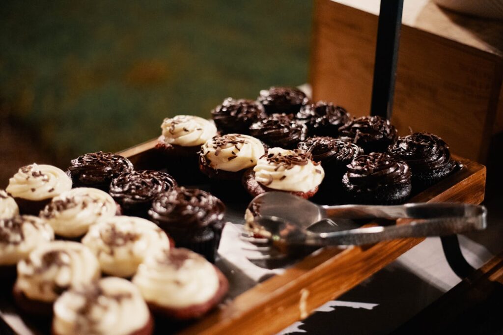 pexels-photo-1546892 Close-up of chocolate and vanilla frosted cupcakes on a tray, perfect for desserts.